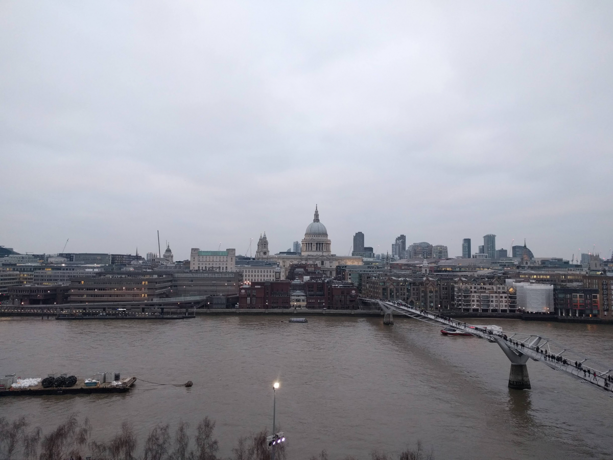 London city skyline. Looking north over the river from the Southbank across to St Pauls cathedral. London looks grey and cloudy.